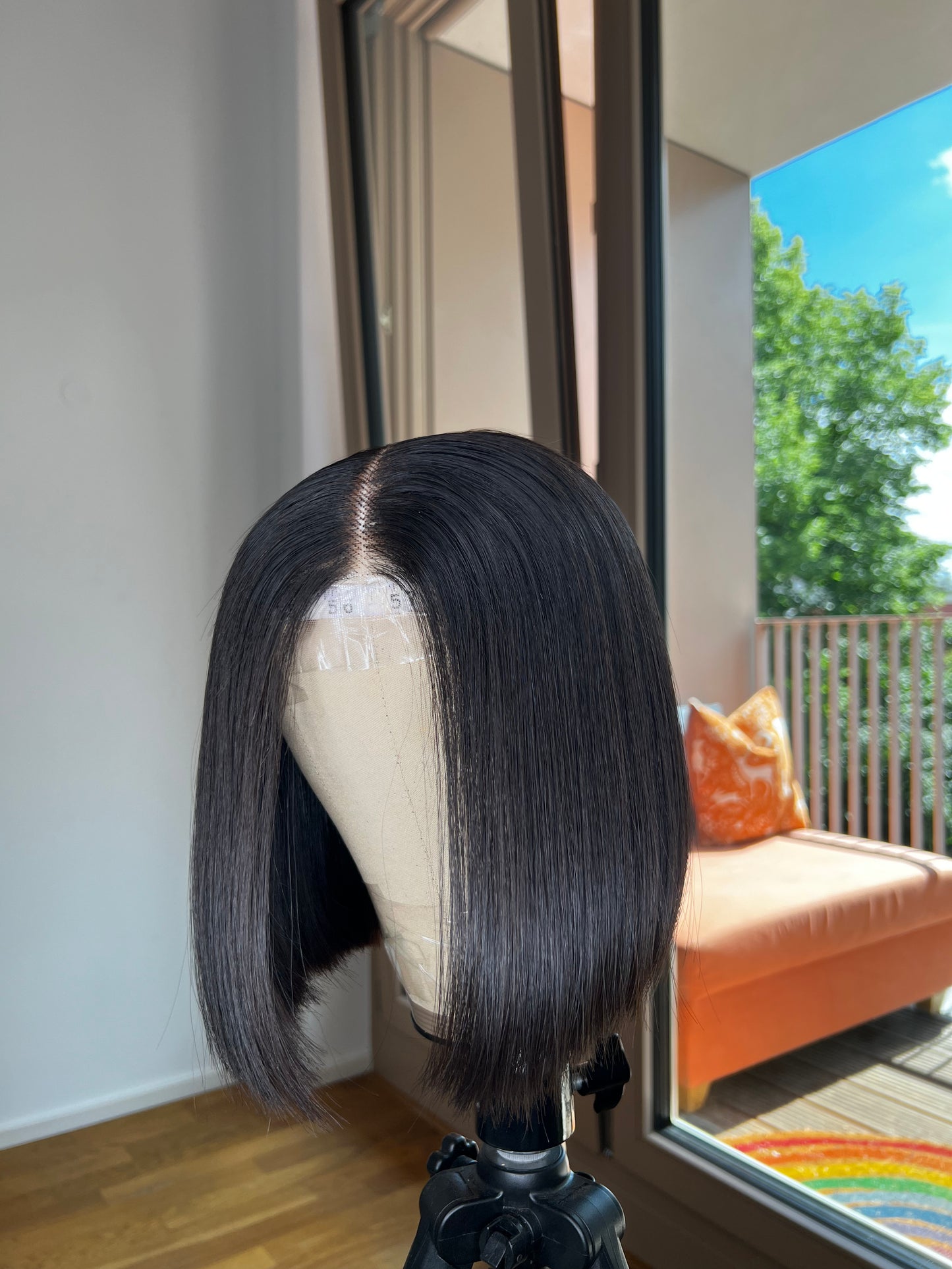 Blunt Cut Bob Wig on canvas mannequin head with a beautiful backdrop