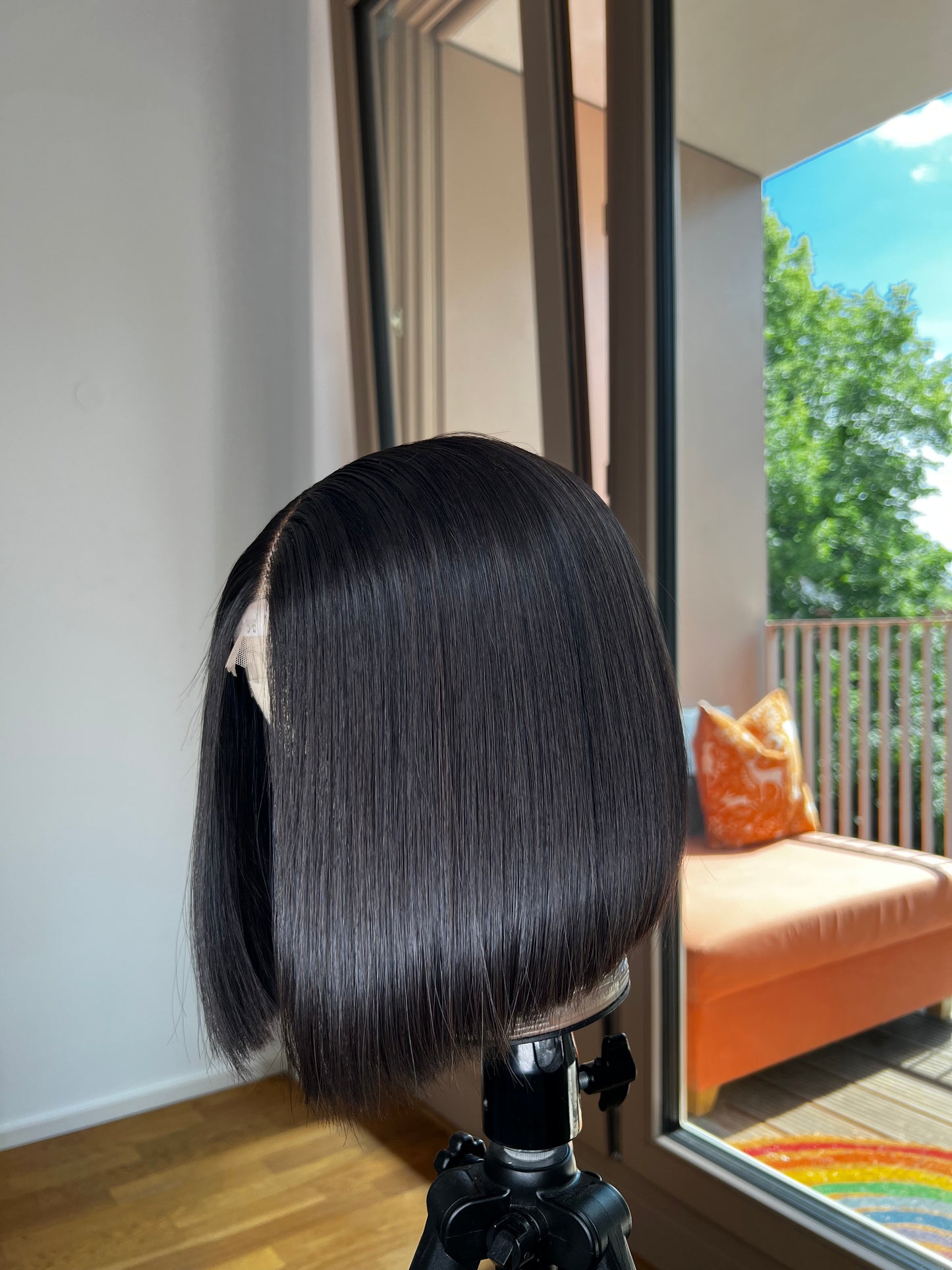 Blunt Cut Bob Wig on canvas mannequin head with a beautiful backdrop